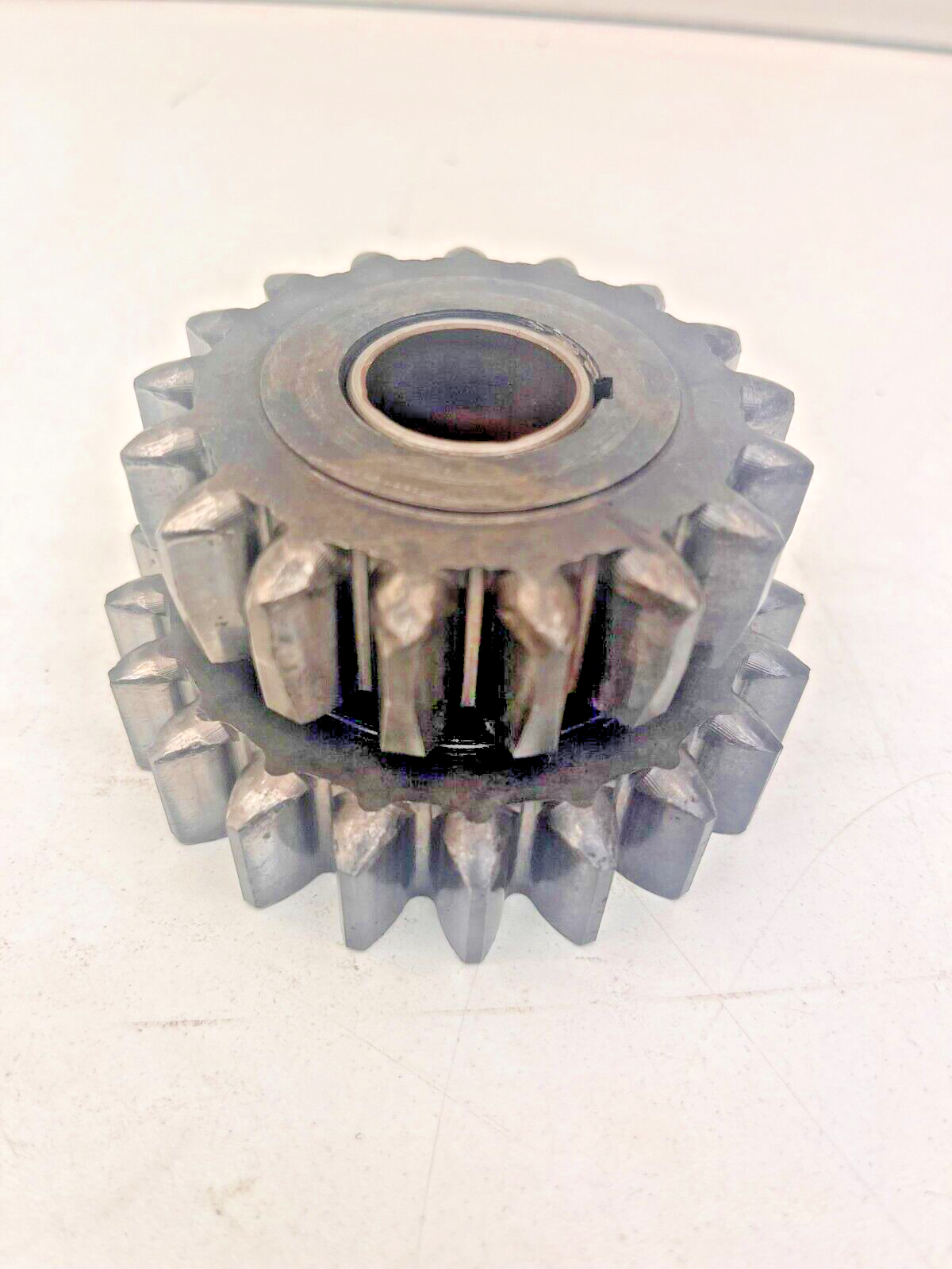 7696749