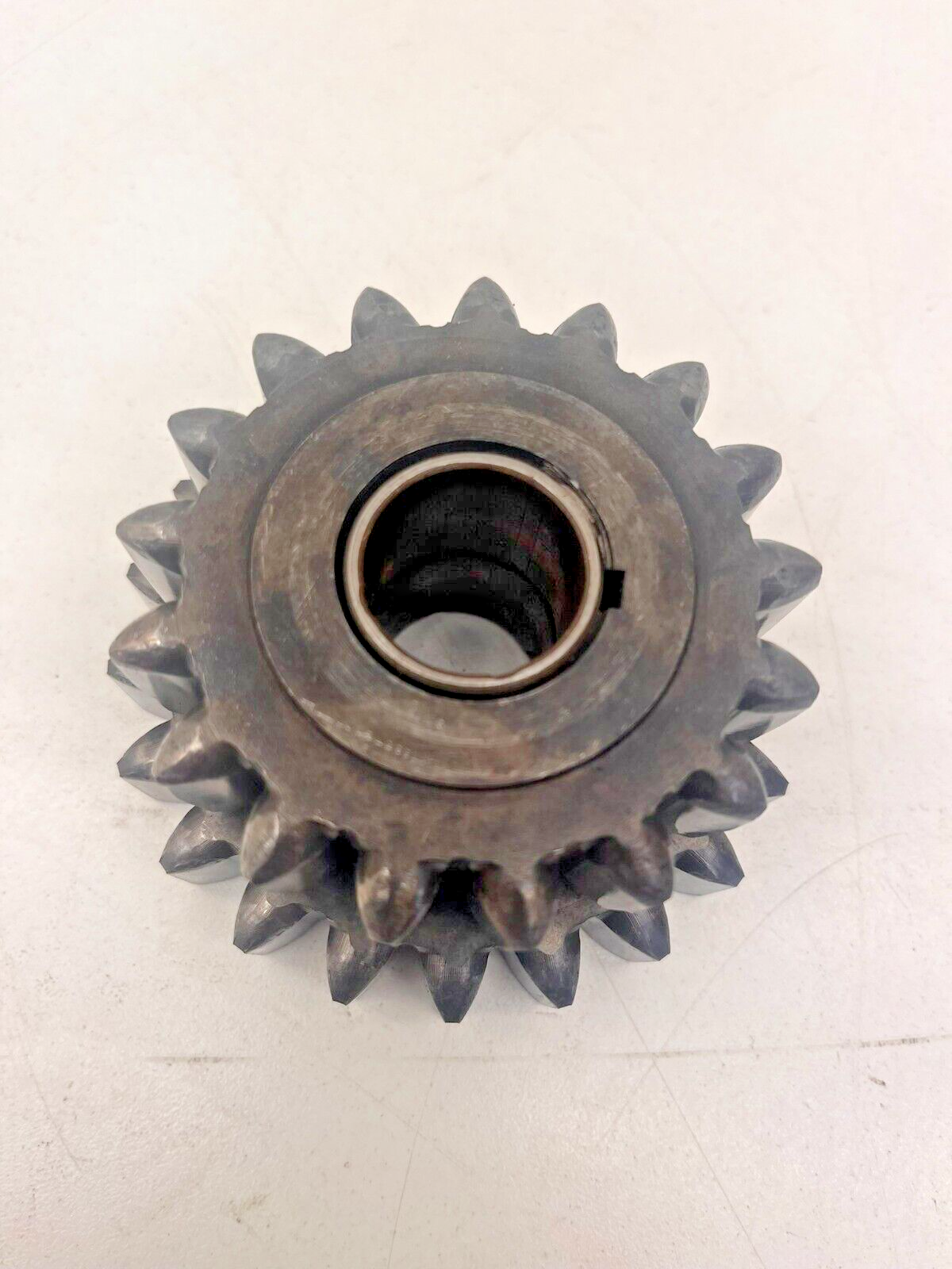 7696749